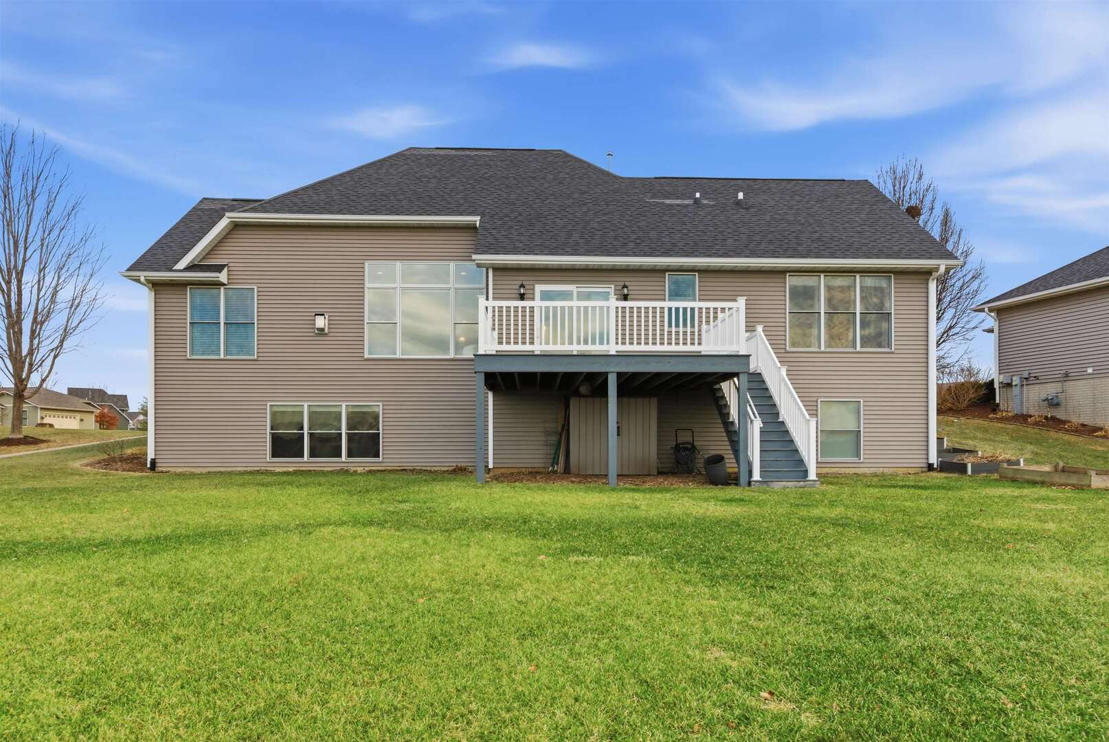 6478 Spring Creek Drive Bettendorf, IA 52722 - Photo 2 of 39 a front view of a house with a yard