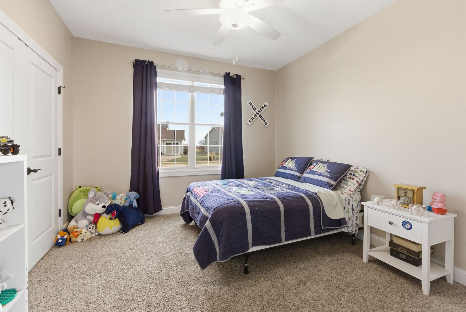 6478 Spring Creek Drive Bettendorf, IA 52722 - Photo 28 of 39 a bedroom with a bed and a window