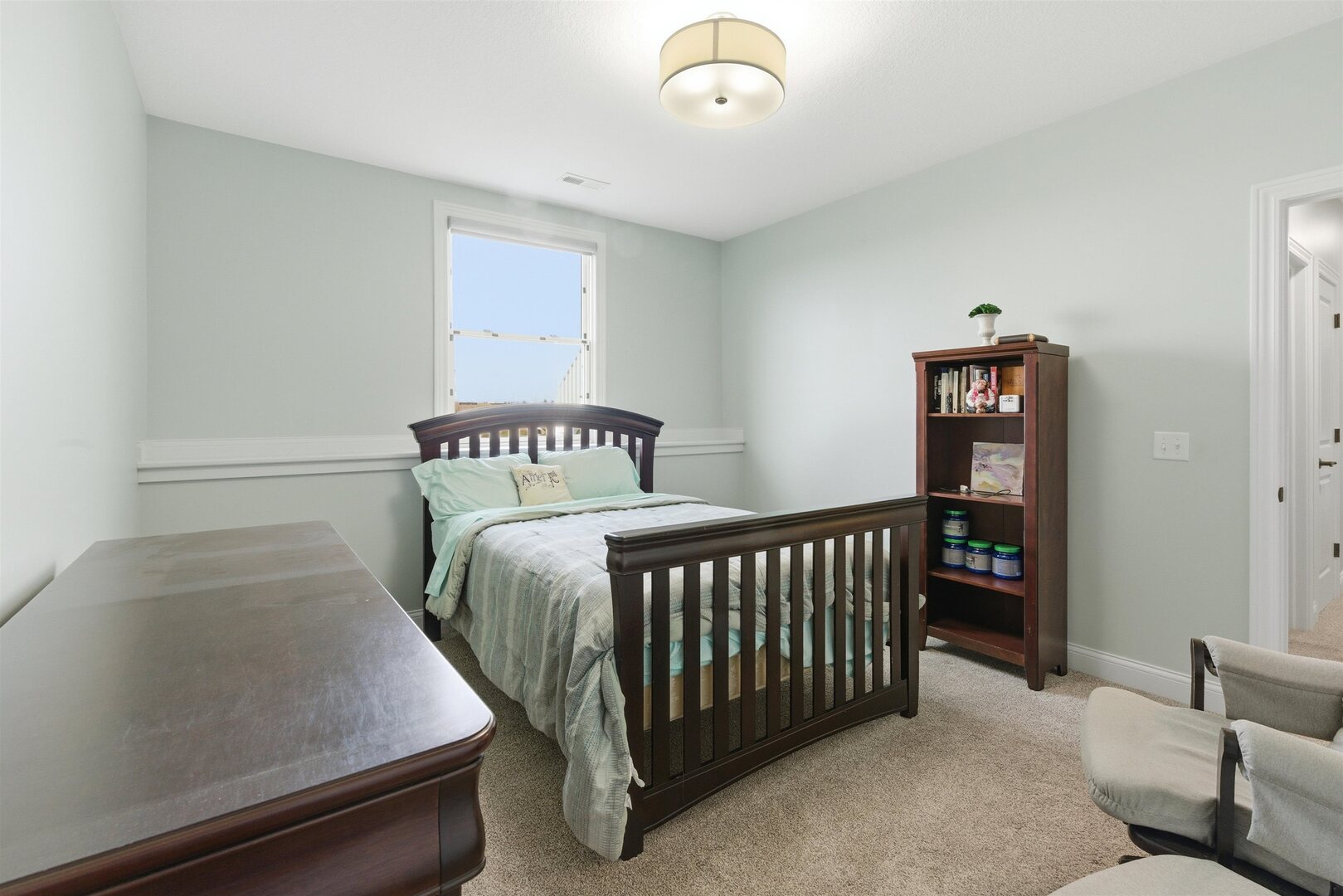 6478 Spring Creek Drive Bettendorf, IA 52722 - Photo 32 of 39 a bedroom with a bed and a window
