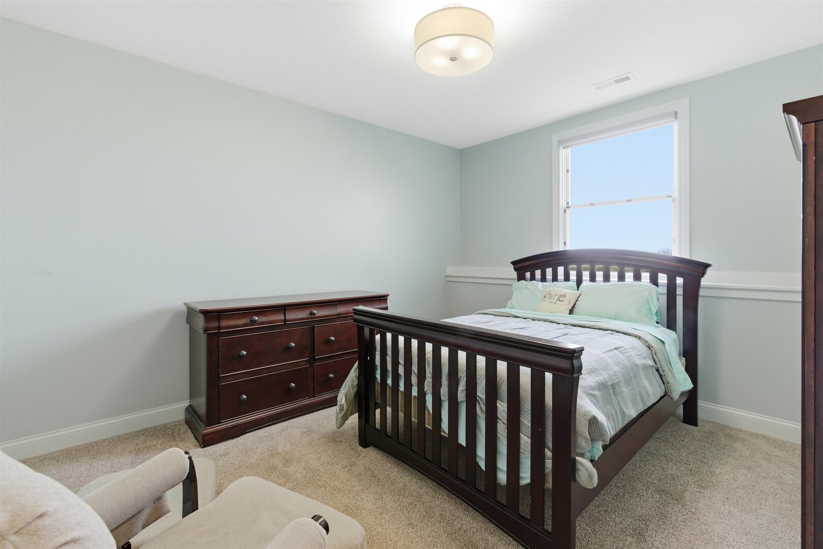 6478 Spring Creek Drive Bettendorf, IA 52722 - Photo 33 of 39 a bedroom with a bed and a table