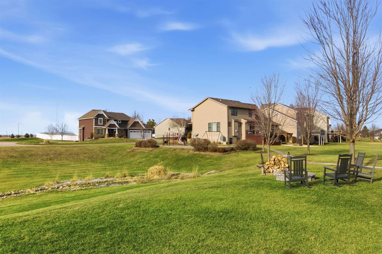 6478 Spring Creek Drive Bettendorf, IA 52722 - Photo 4 of 39 a front view of a house with garden