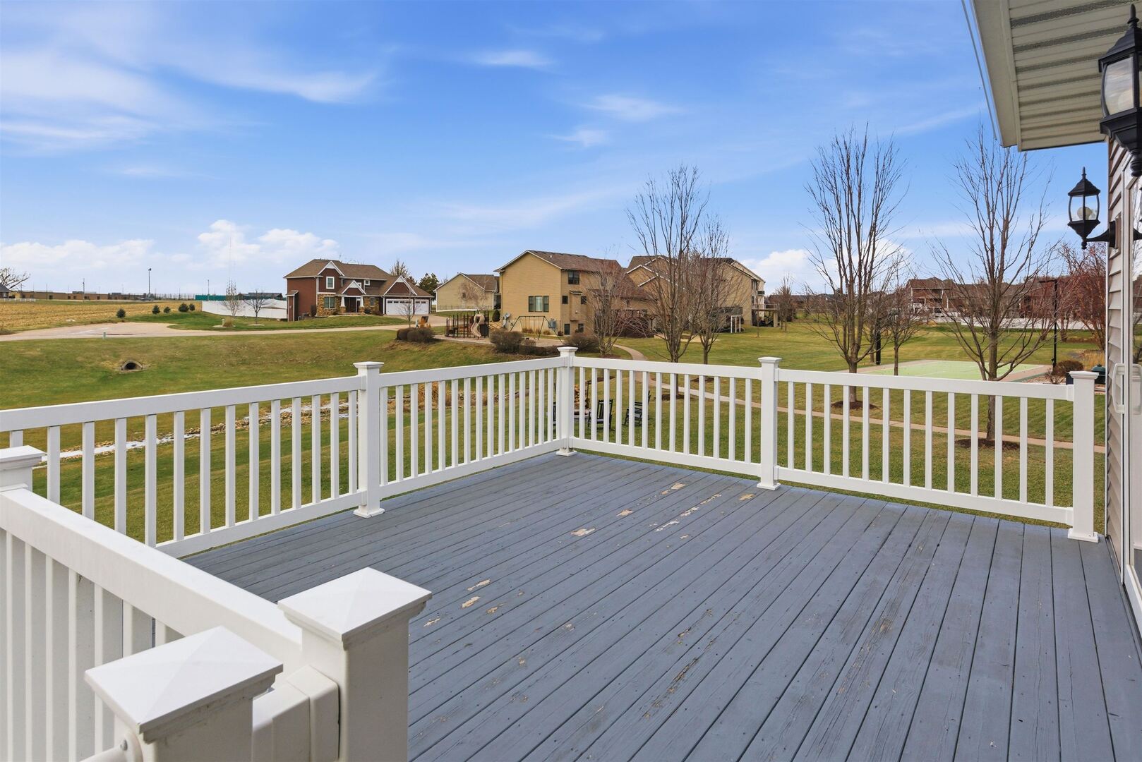 6478 Spring Creek Drive Bettendorf, IA 52722 - Photo 6 of 39 a view of a balcony with wooden floor