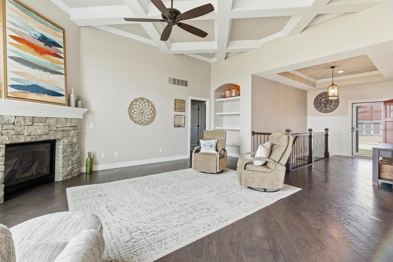 6478 Spring Creek Drive Bettendorf, IA 52722 - Photo 10 of 39 a living room with furniture and a fireplace