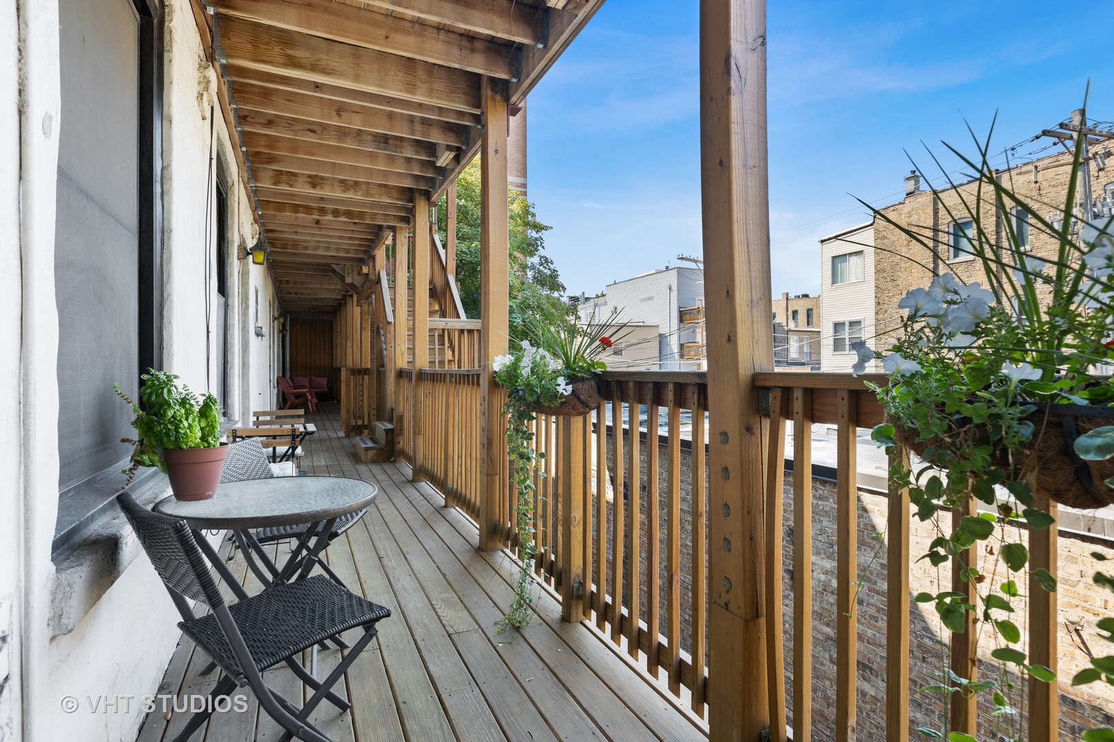 2956 North Halsted Street, Unit 2 Chicago, IL 60657 - Photo 13 of 13 a view of two chairs and table in the balcony