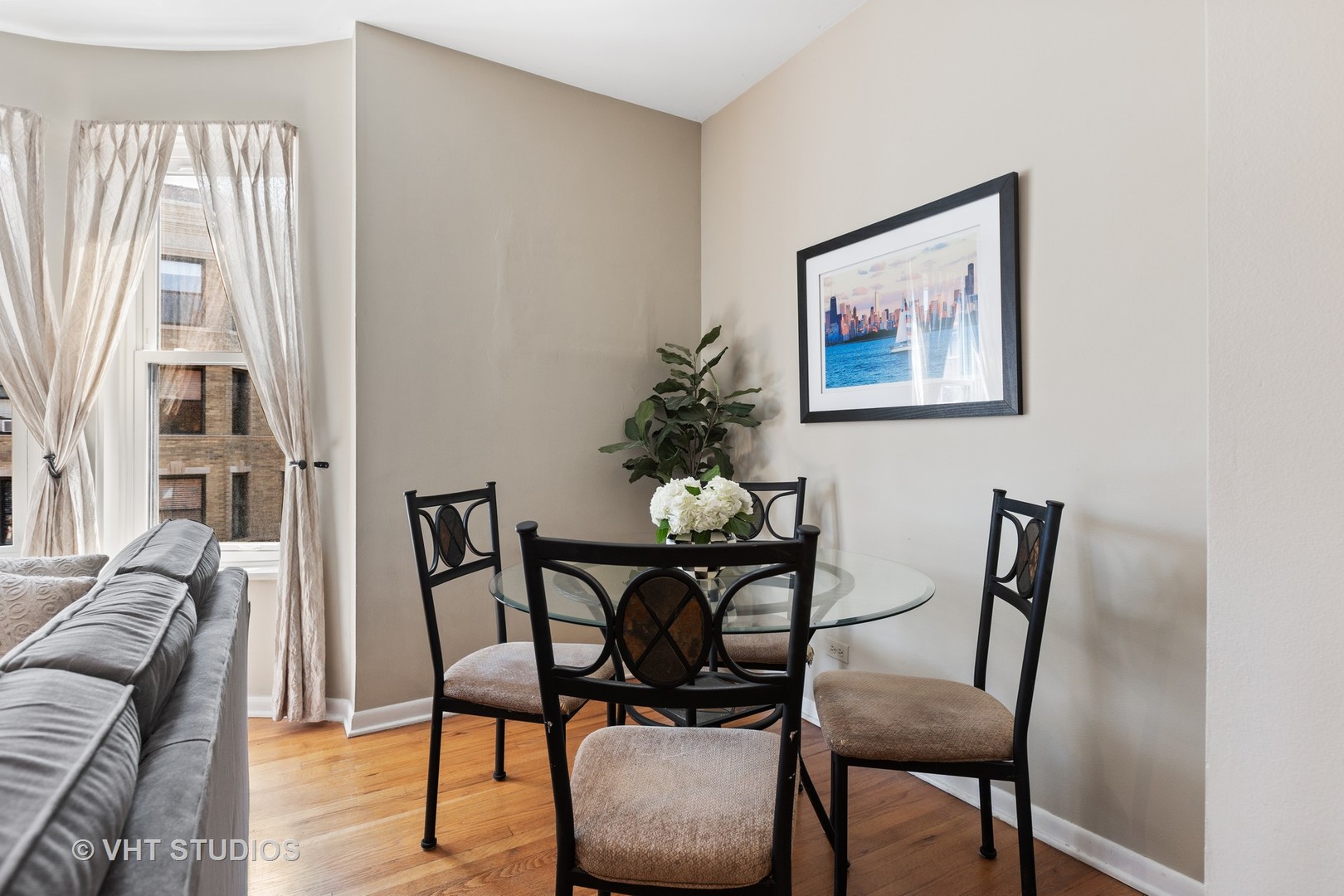 2956 North Halsted Street, Unit 2 Chicago, IL 60657 - Photo 5 of 13 a view of a dining room with furniture and wooden floor