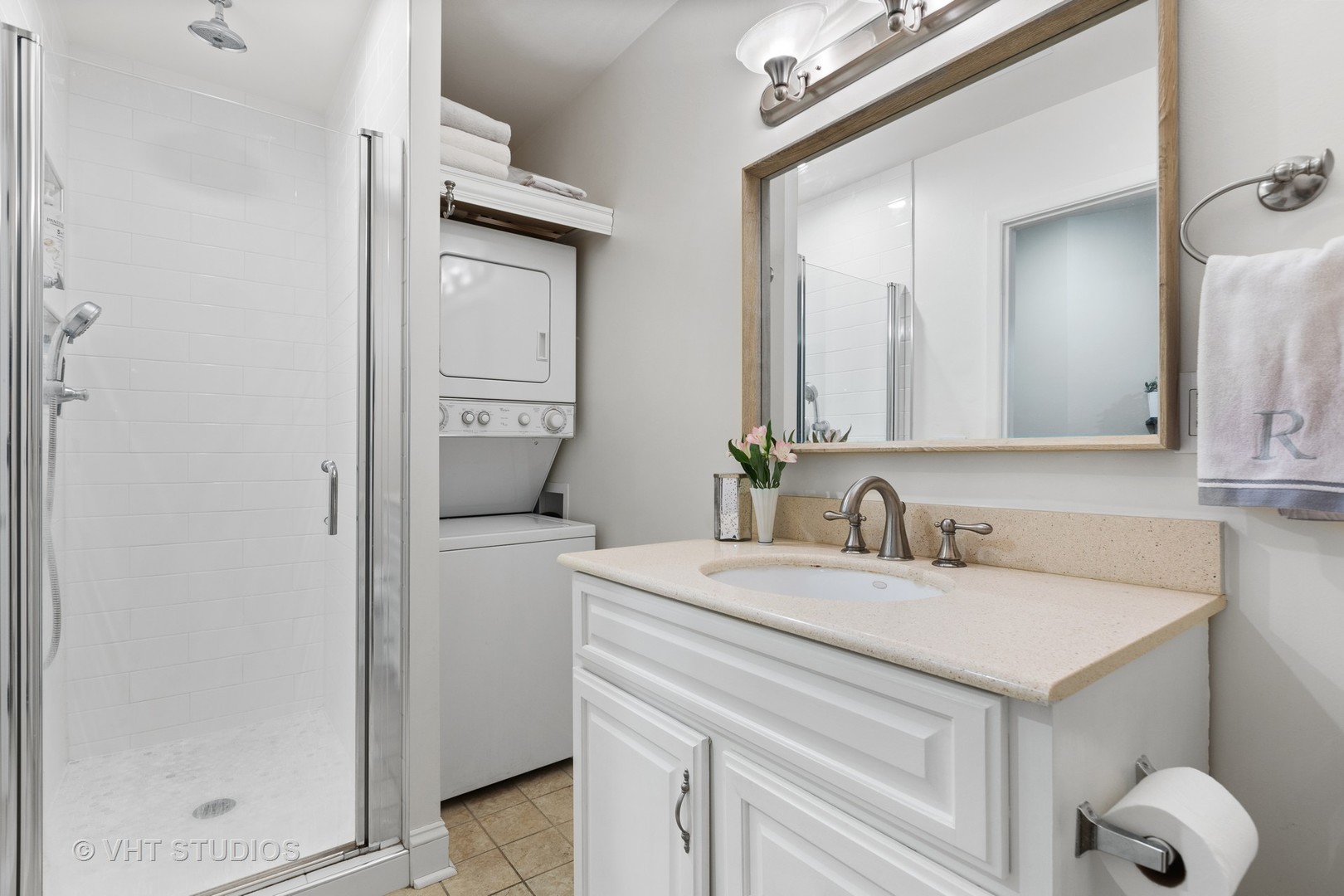 2956 North Halsted Street, Unit 2 Chicago, IL 60657 - Photo 9 of 13 a bathroom with a sink and a mirror