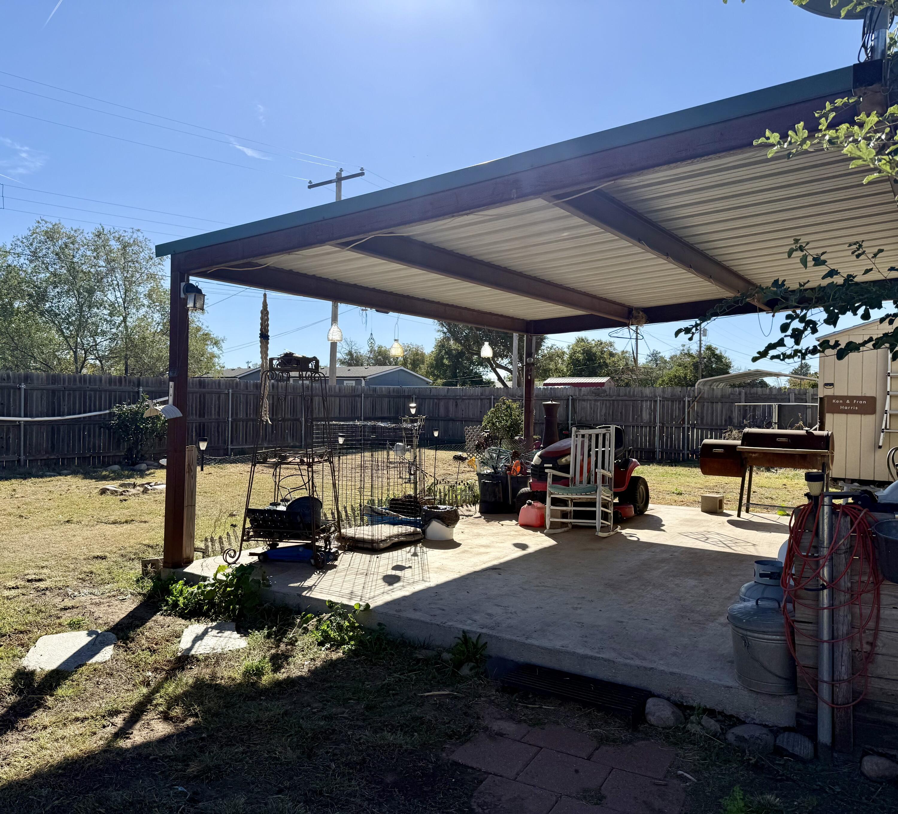 503 2nd Street Lorenzo, TX 79343 - Photo 13 of 13 a view of a patio with table and chairs under an umbrella