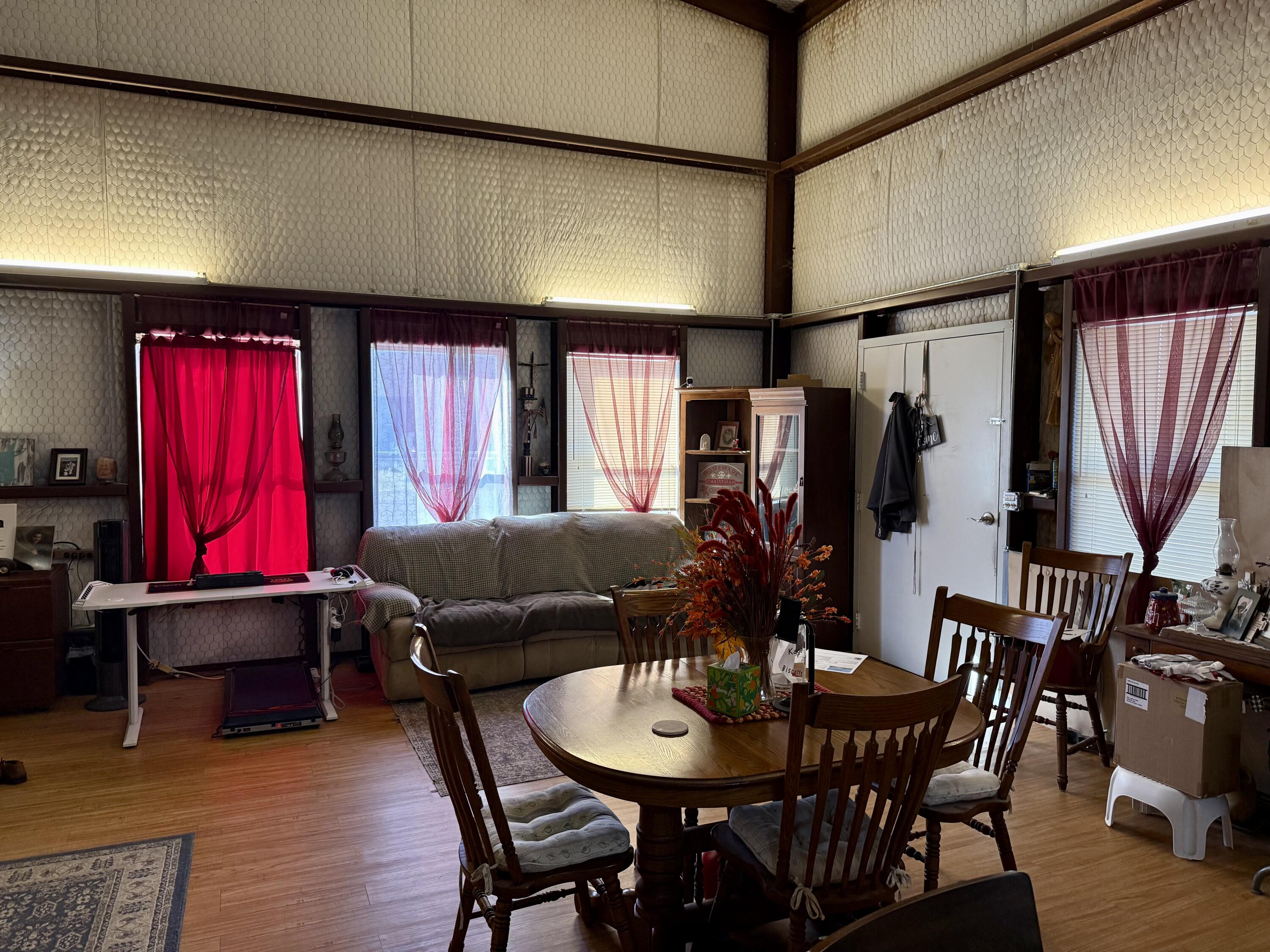 503 2nd Street Lorenzo, TX 79343 - Photo 5 of 13 a living room with furniture a desk and chair with wooden floor