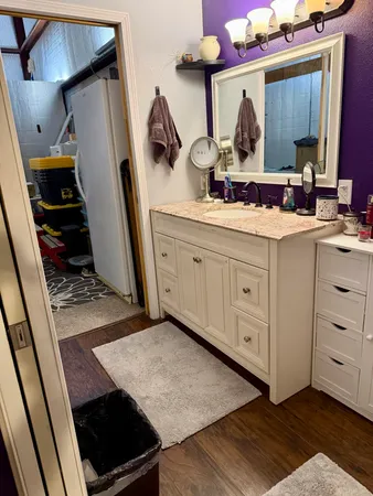 a bathroom with a sink and a mirror