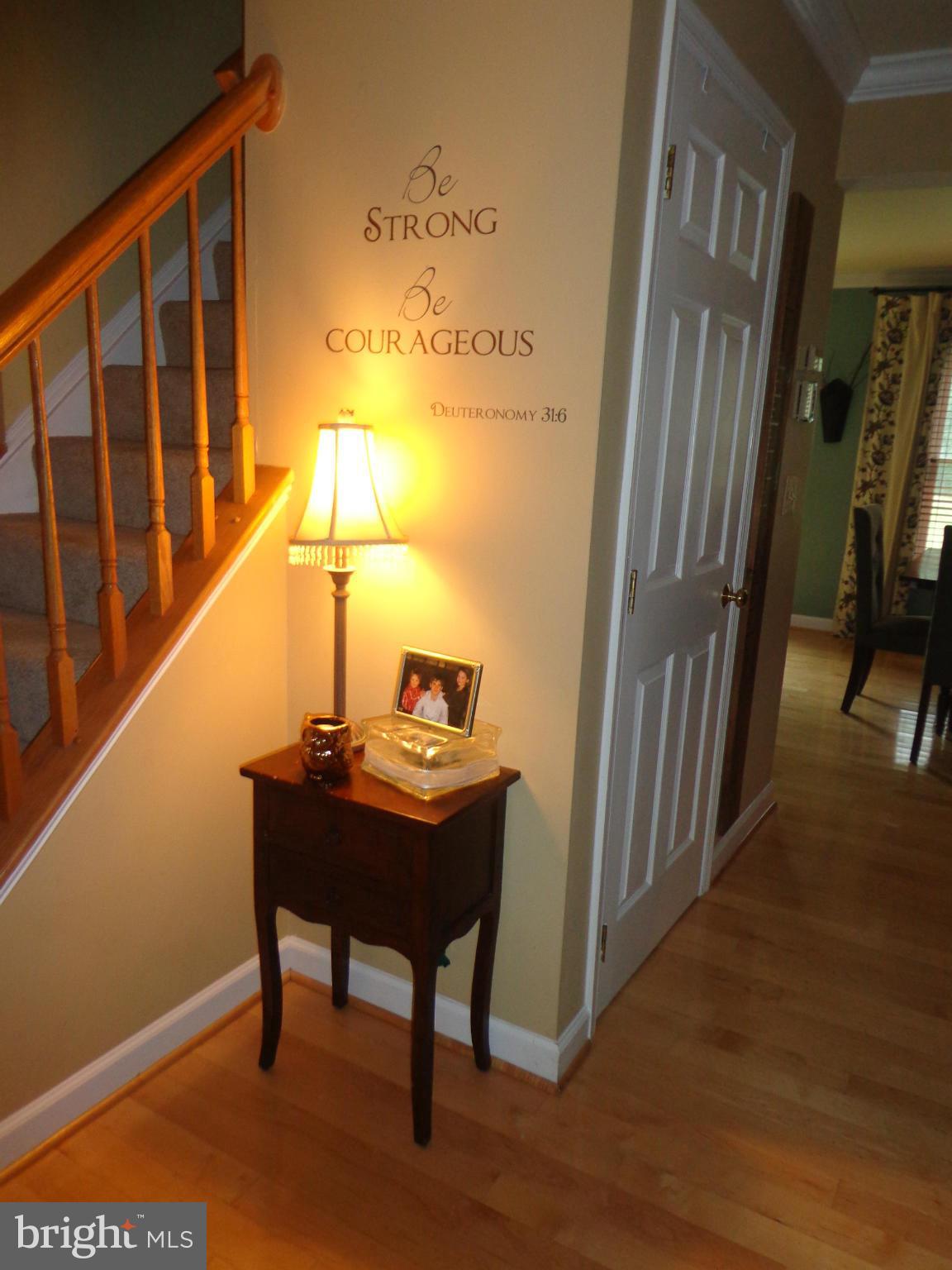 9323 Settle School Road Rixeyville, VA 22737 - Photo 19 of 30 a view of a hallway with paintings on the wall