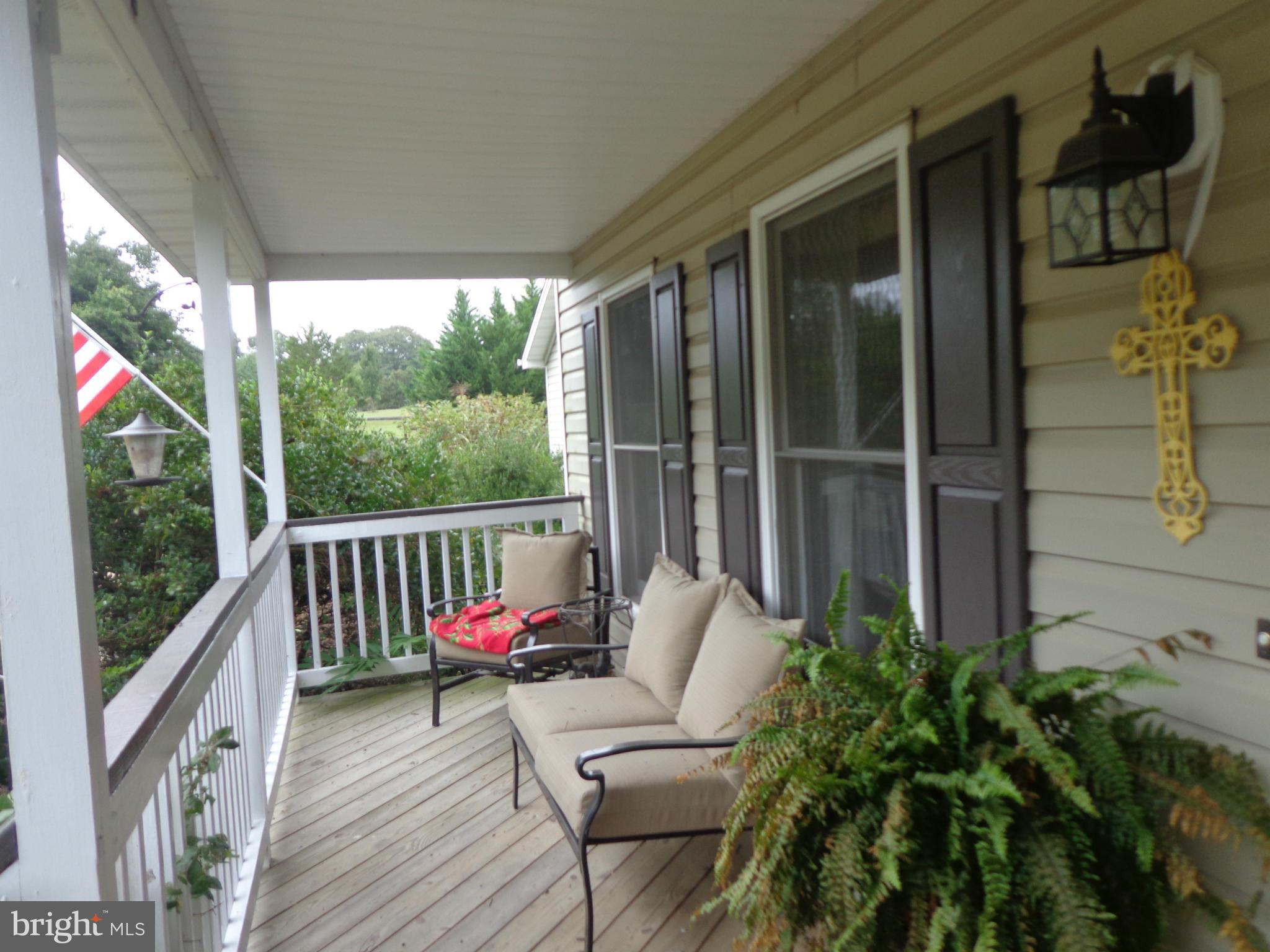 9323 Settle School Road Rixeyville, VA 22737 - Photo 26 of 30 a balcony with furniture and a potted plant