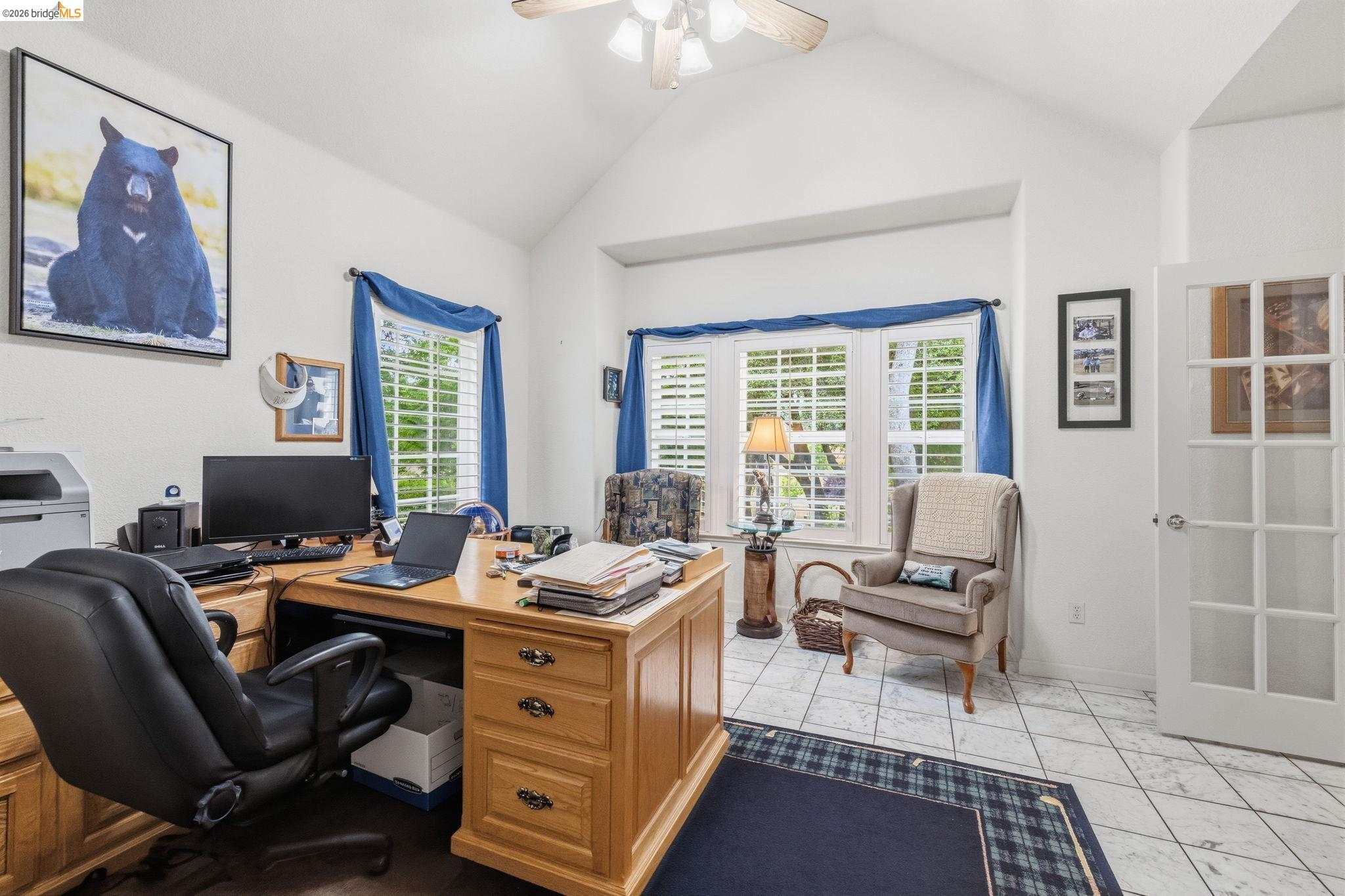 18450 Lambert Lake Road Sonora, CA 95370 - Photo 21 of 87 Vaulted ceiling with a ceiling fan, bay window with plantation shutters, French doors, and tile flooring