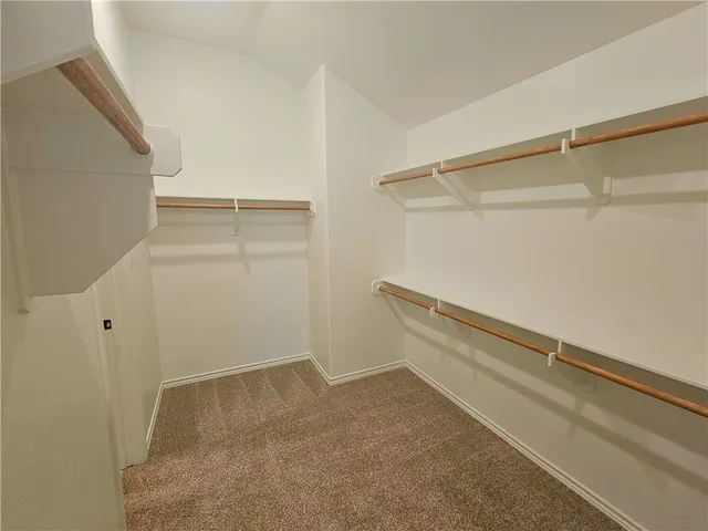 a view of an empty walk in closet