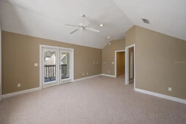 a bathroom with a sink mirror vanity and toilet