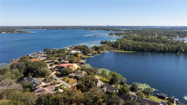 an aerial view of a house with a lake view