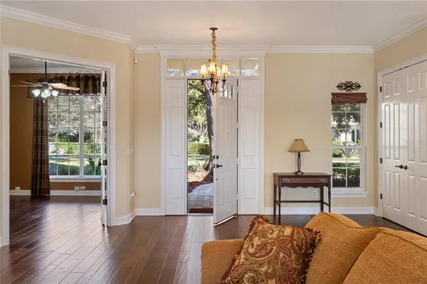 a bedroom with furniture and a chandelier
