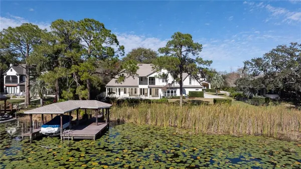 an aerial view of a house with a yard