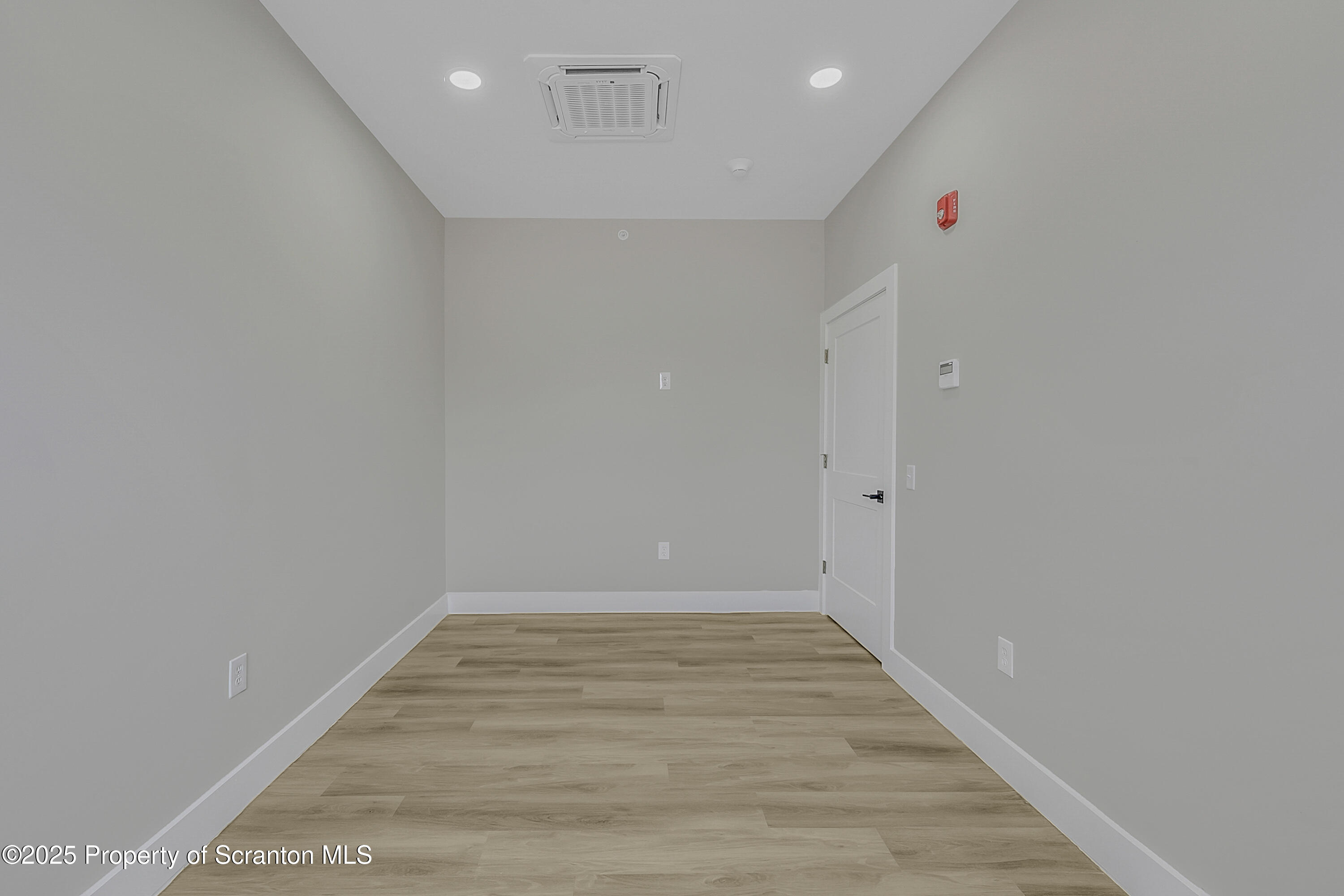 215 Hickory Street, Unit 9 Scranton, PA 18505 - Photo 11 of 19 a view of an empty room with wooden floor