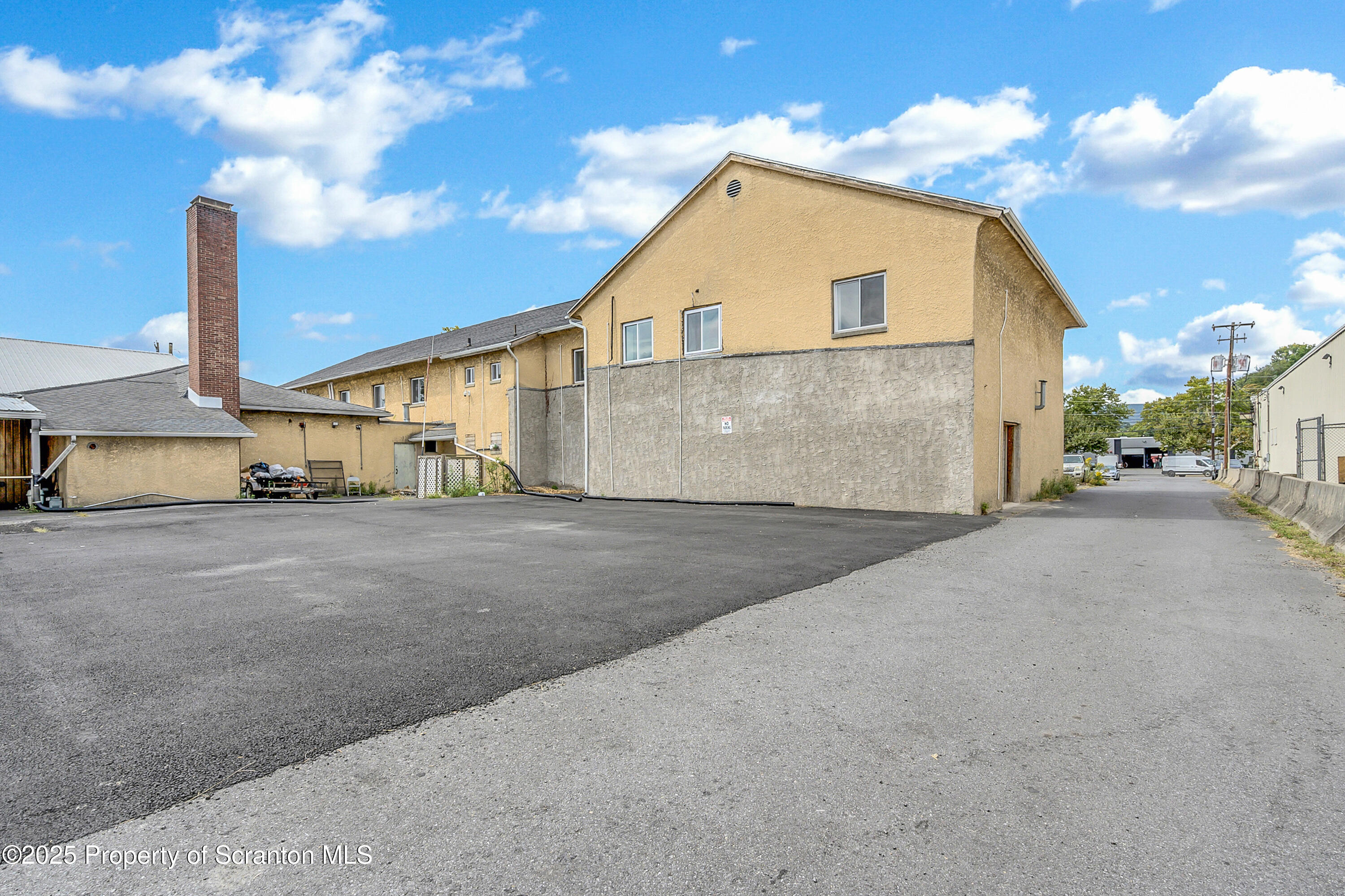 215 Hickory Street, Unit 9 Scranton, PA 18505 - Photo 19 of 19 a view of a house with a yard