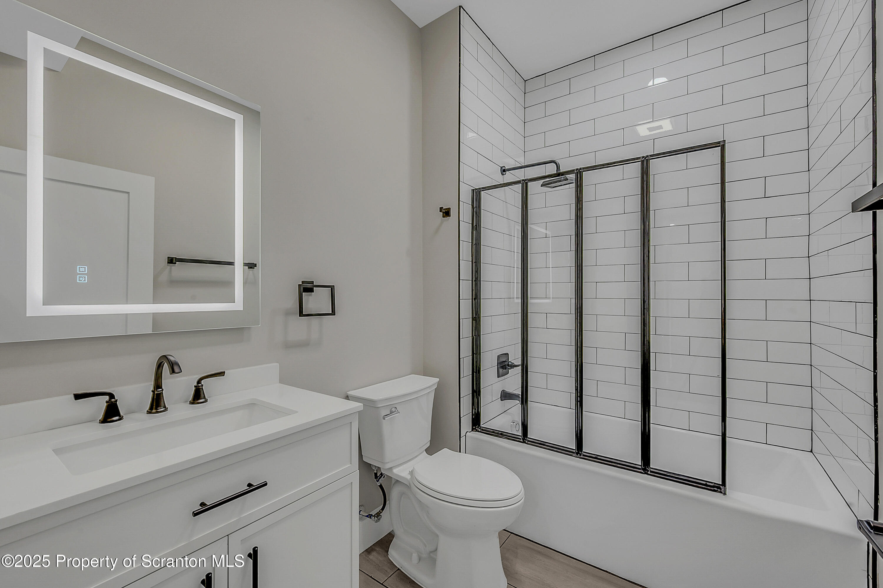 215 Hickory Street, Unit 9 Scranton, PA 18505 - Photo 6 of 19 a bathroom with a sink toilet and shower