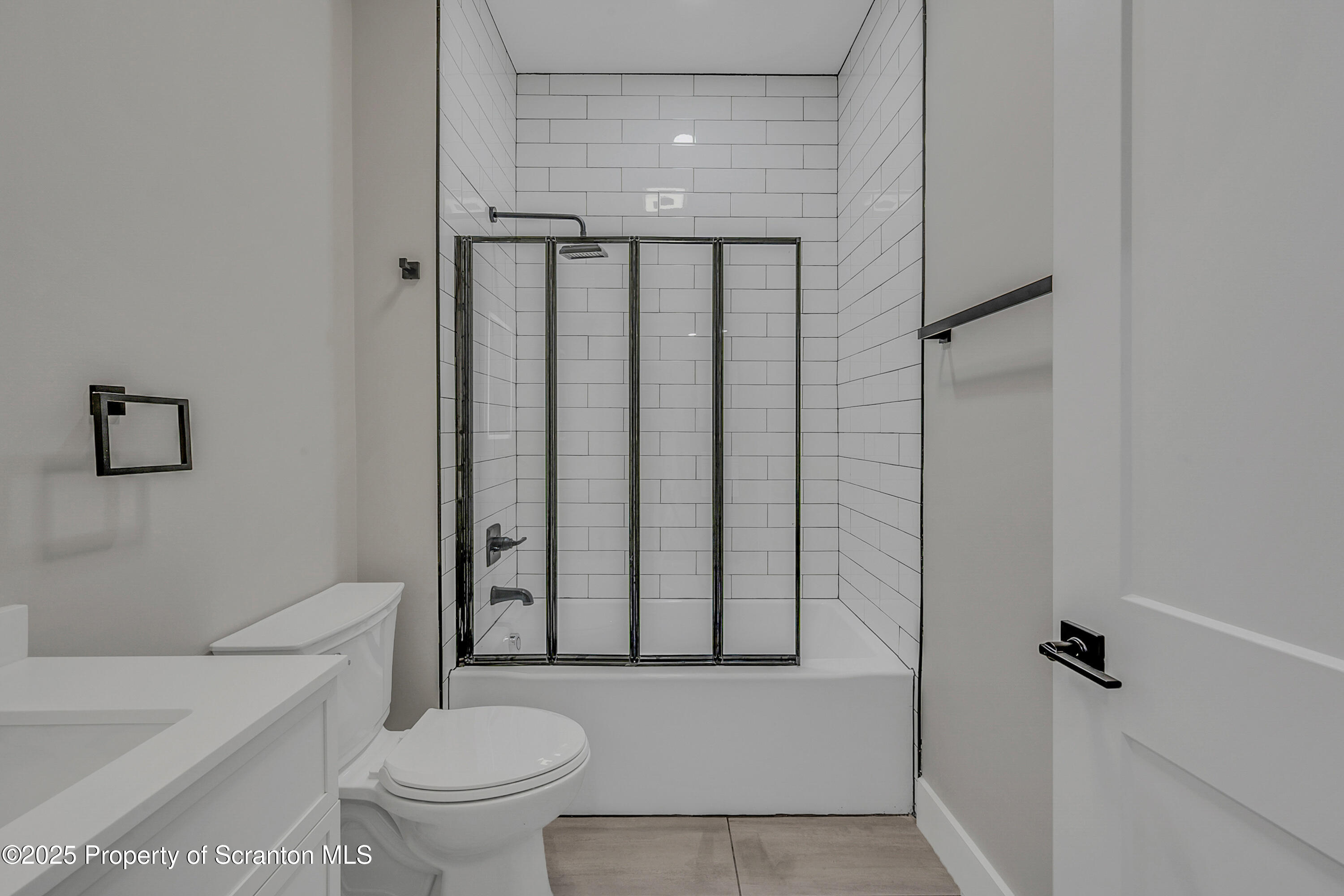 215 Hickory Street, Unit 9 Scranton, PA 18505 - Photo 8 of 19 a bathroom with a toilet and a shower