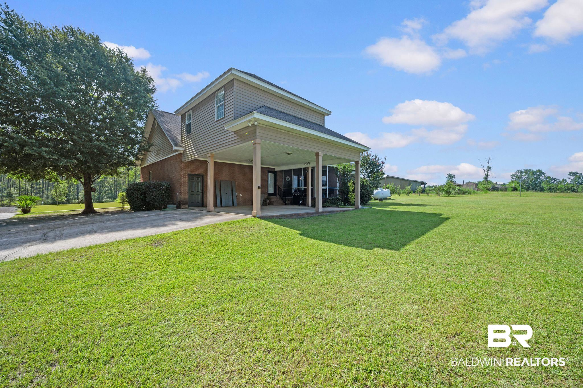 48513 Phillipsville Road Bay Minette, AL 36507 - Photo 43 of 50 Rear view of house with a yard