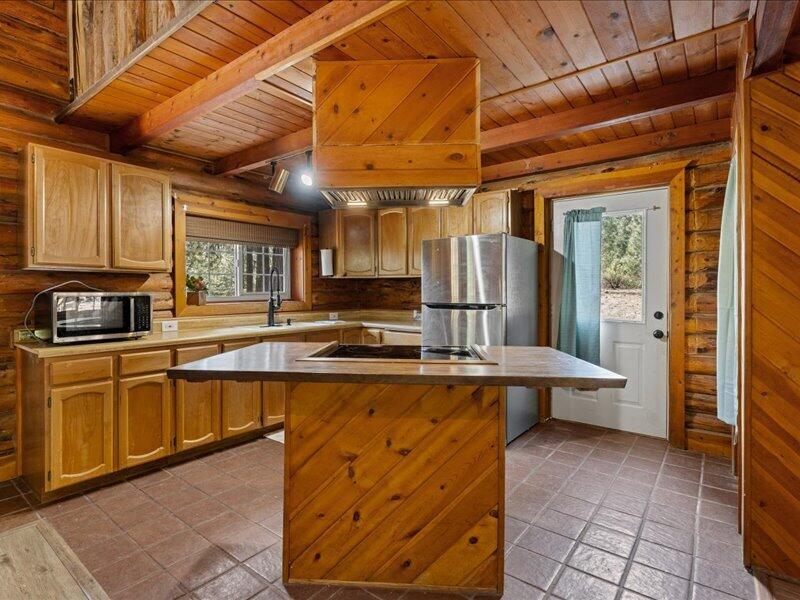 40060 Incline Drive Chiloquin, OR 97624 - Photo 7 of 26 a kitchen with stainless steel appliances granite countertop a stove a sink and dishwasher