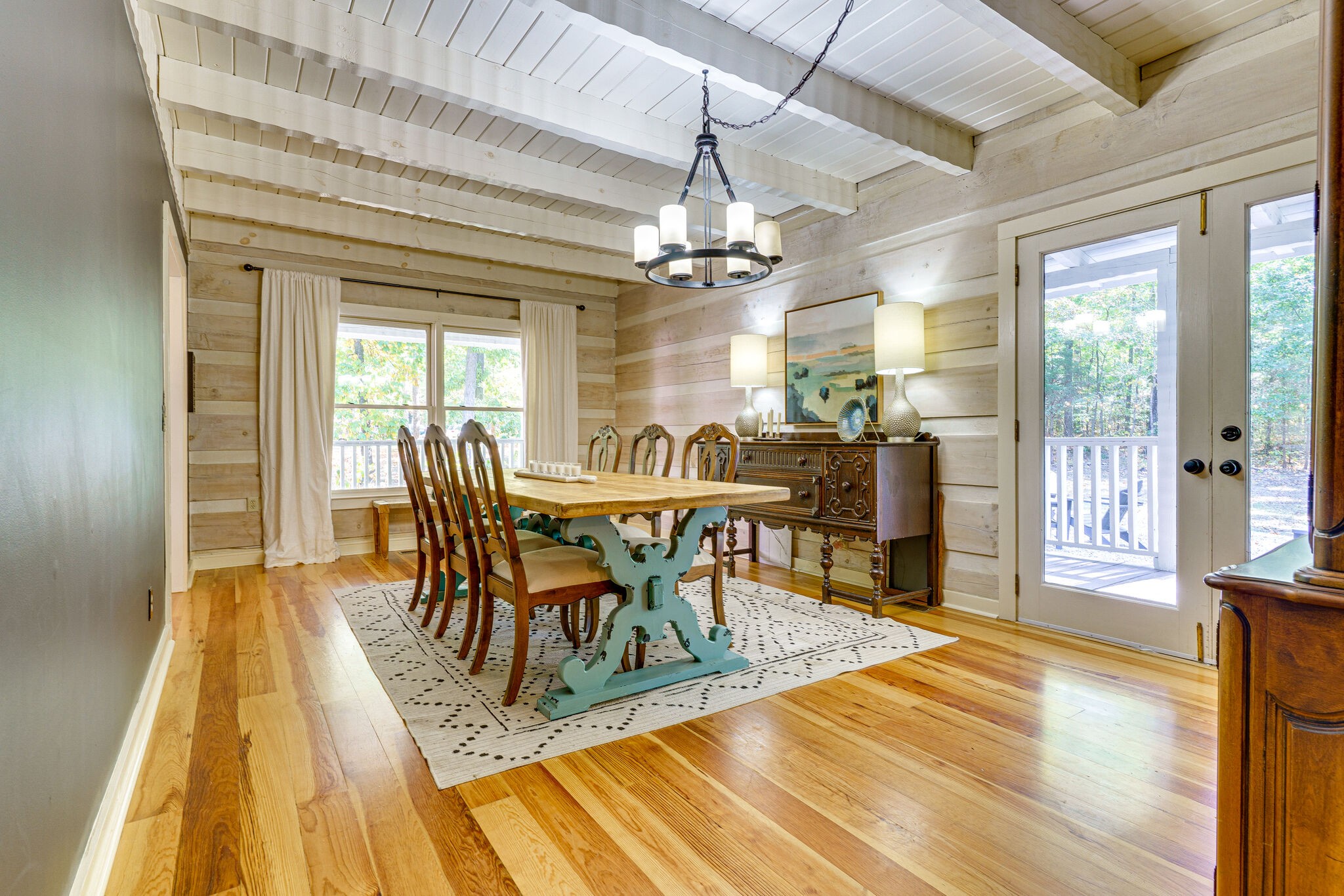 1500 Fallen Beetree Road Kingston Springs, TN 37082 - Photo 11 of 47 a dining room with wooden floor a chandelier a wooden table and chairs