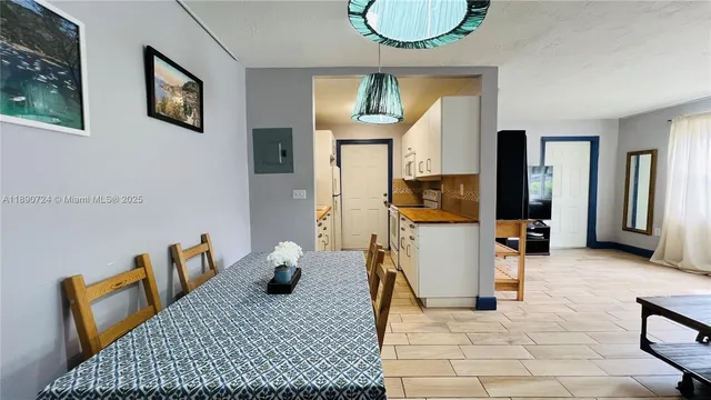 a view of living room filled with furniture and window