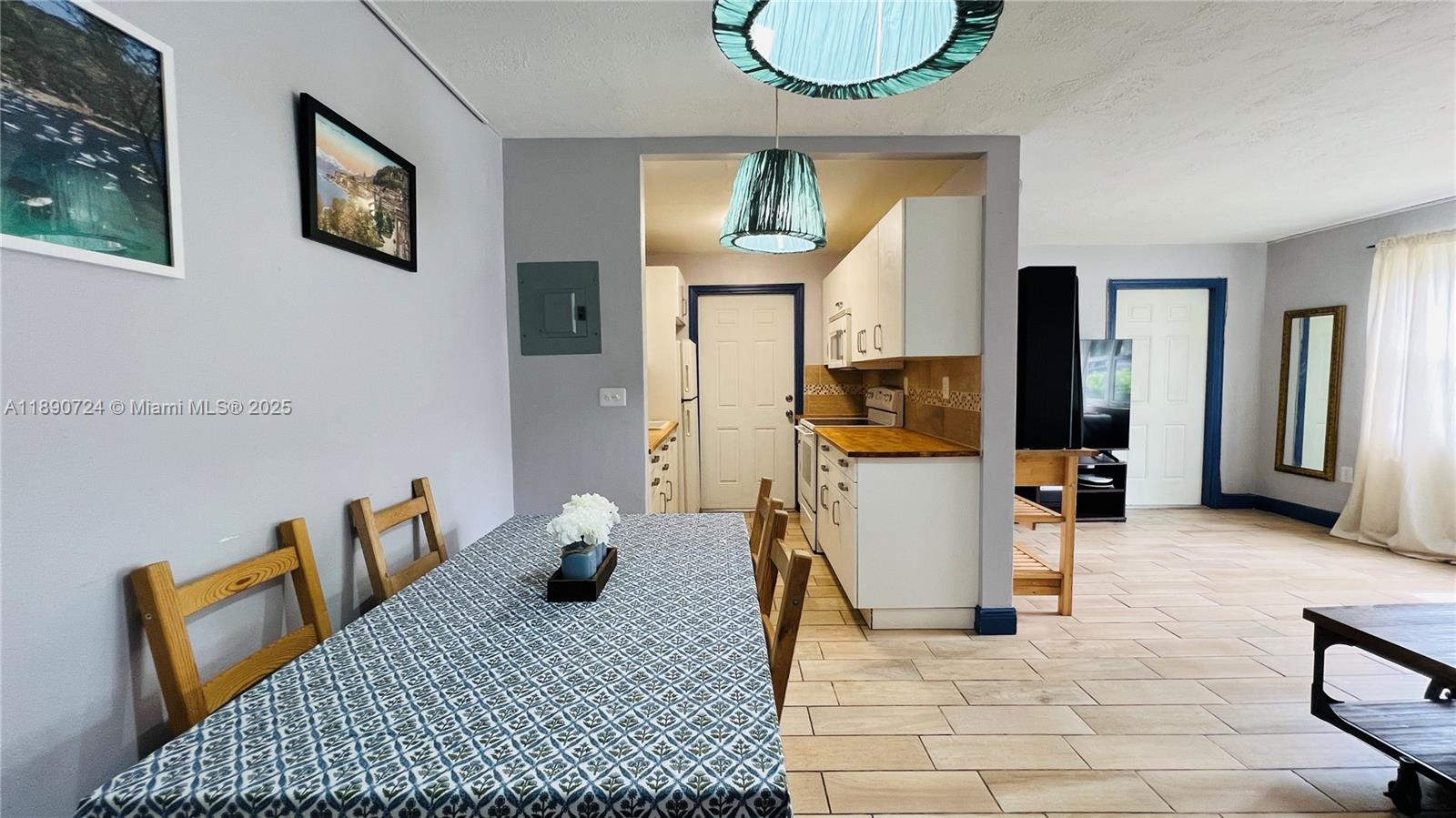 801 Meridian Avenue, Unit 1A Miami Beach, FL 33139 - Photo 7 of 18 a view of living room filled with furniture and window