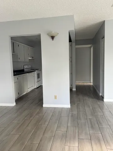 a view of a kitchen with a sink and dishwasher oven next to a window