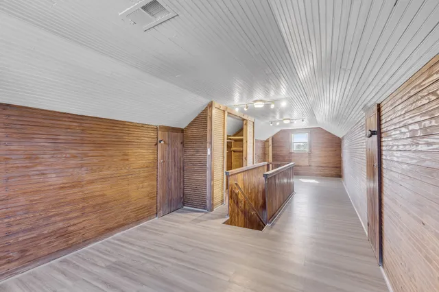 a view of gallery with wooden floor