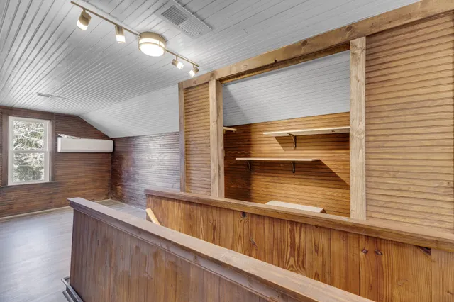 a view of a balcony and car parked