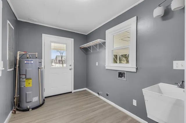 a view of an entryway with wooden floor