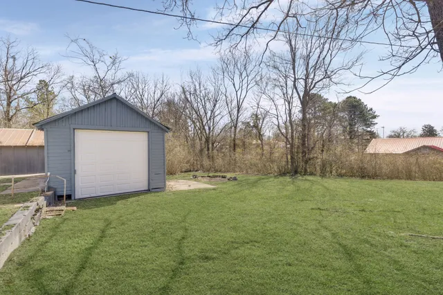 a big house with a big yard and large trees