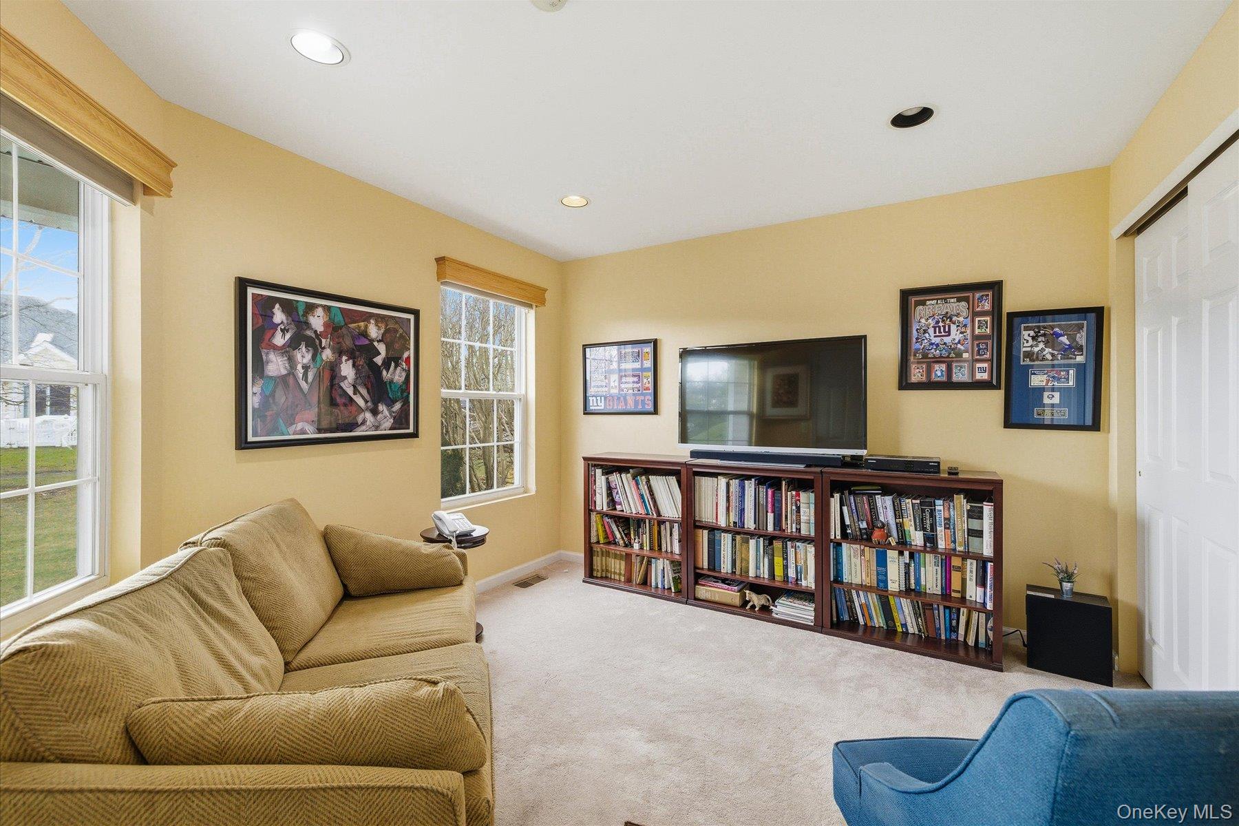 23 Goose Neck Lane Riverhead, NY 11901 - Photo 11 of 28 a living room with furniture and a window