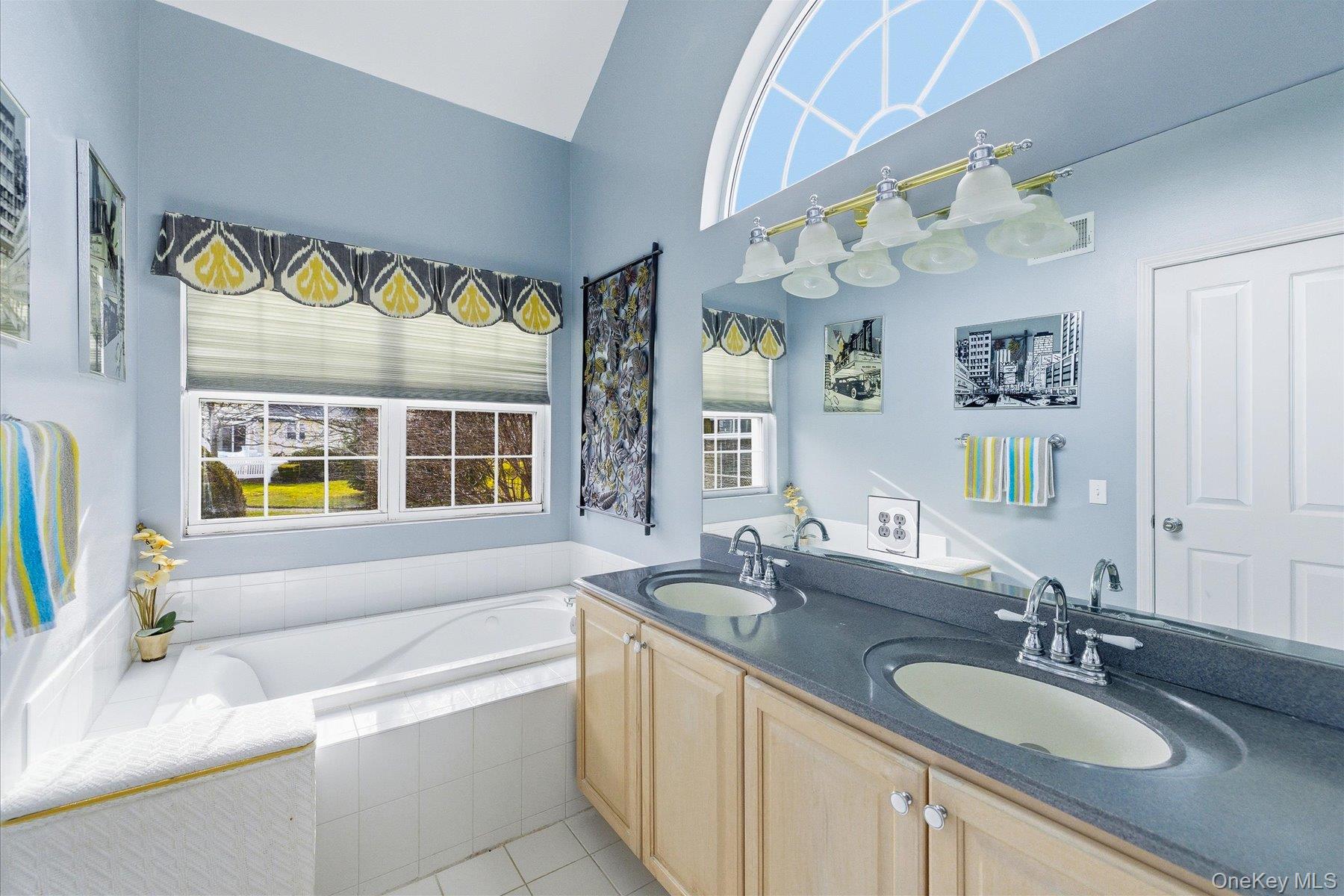 23 Goose Neck Lane Riverhead, NY 11901 - Photo 16 of 28 a bathroom with a granite countertop sink and a mirror