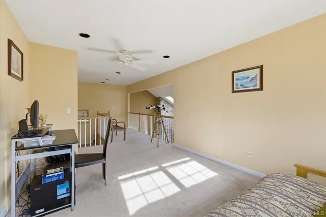 a view of a livingroom with furniture and a window