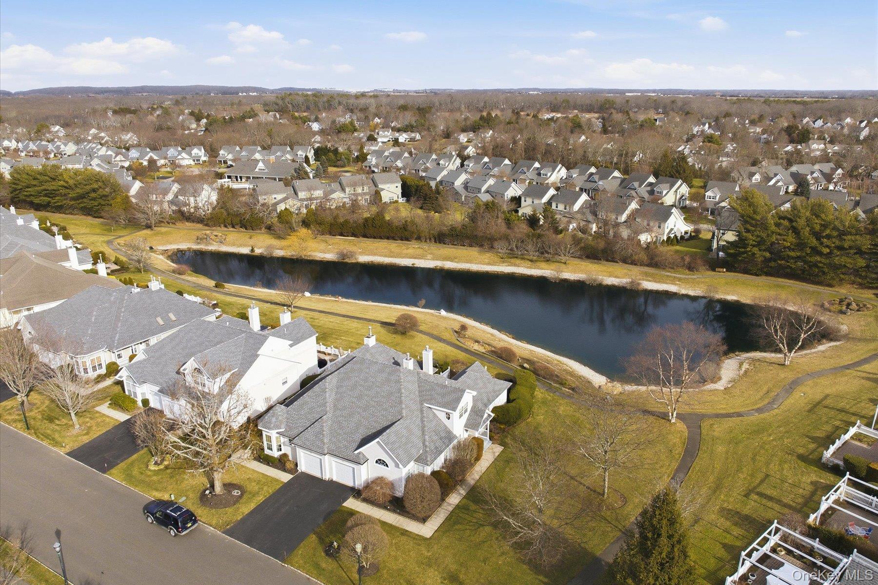 23 Goose Neck Lane Riverhead, NY 11901 - Photo 3 of 28 an aerial view of residential houses with outdoor space