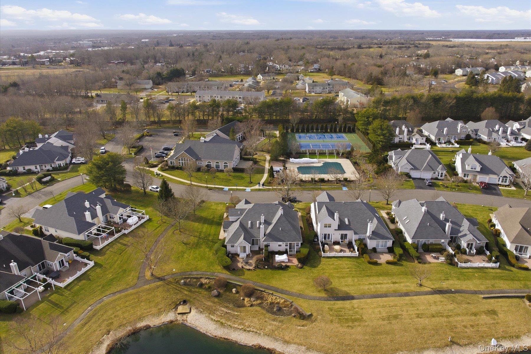23 Goose Neck Lane Riverhead, NY 11901 - Photo 4 of 28 an aerial view of residential houses with outdoor space