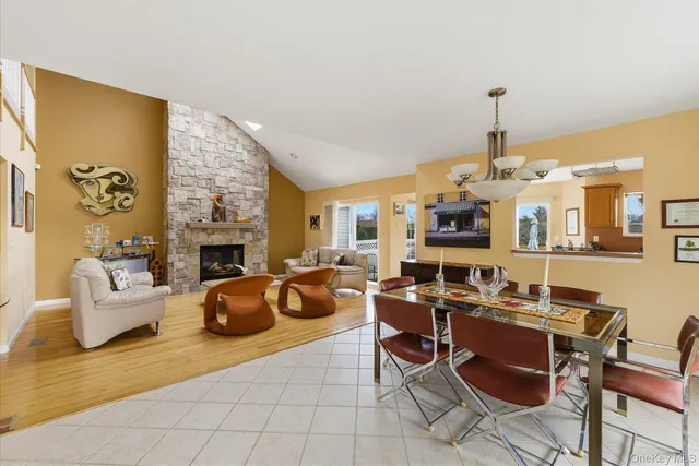 a living room with fireplace furniture and a fireplace