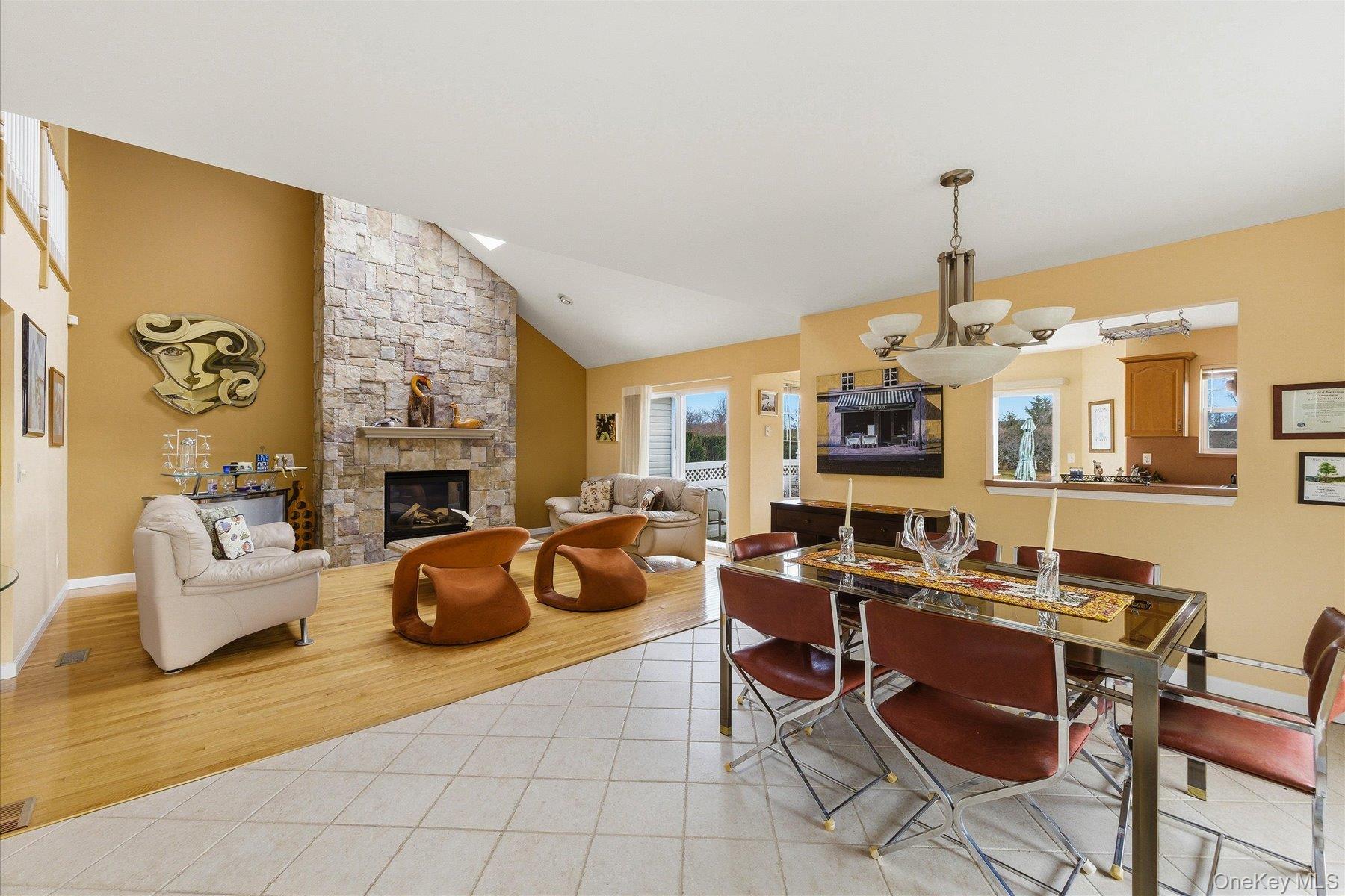 23 Goose Neck Lane Riverhead, NY 11901 - Photo 6 of 28 a living room with fireplace furniture and a fireplace