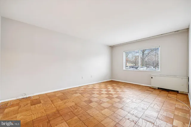 a view of an empty room with a window