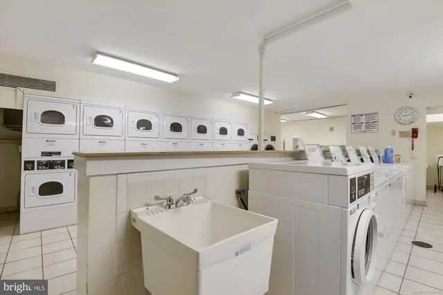 a view of a sink and washer dryer