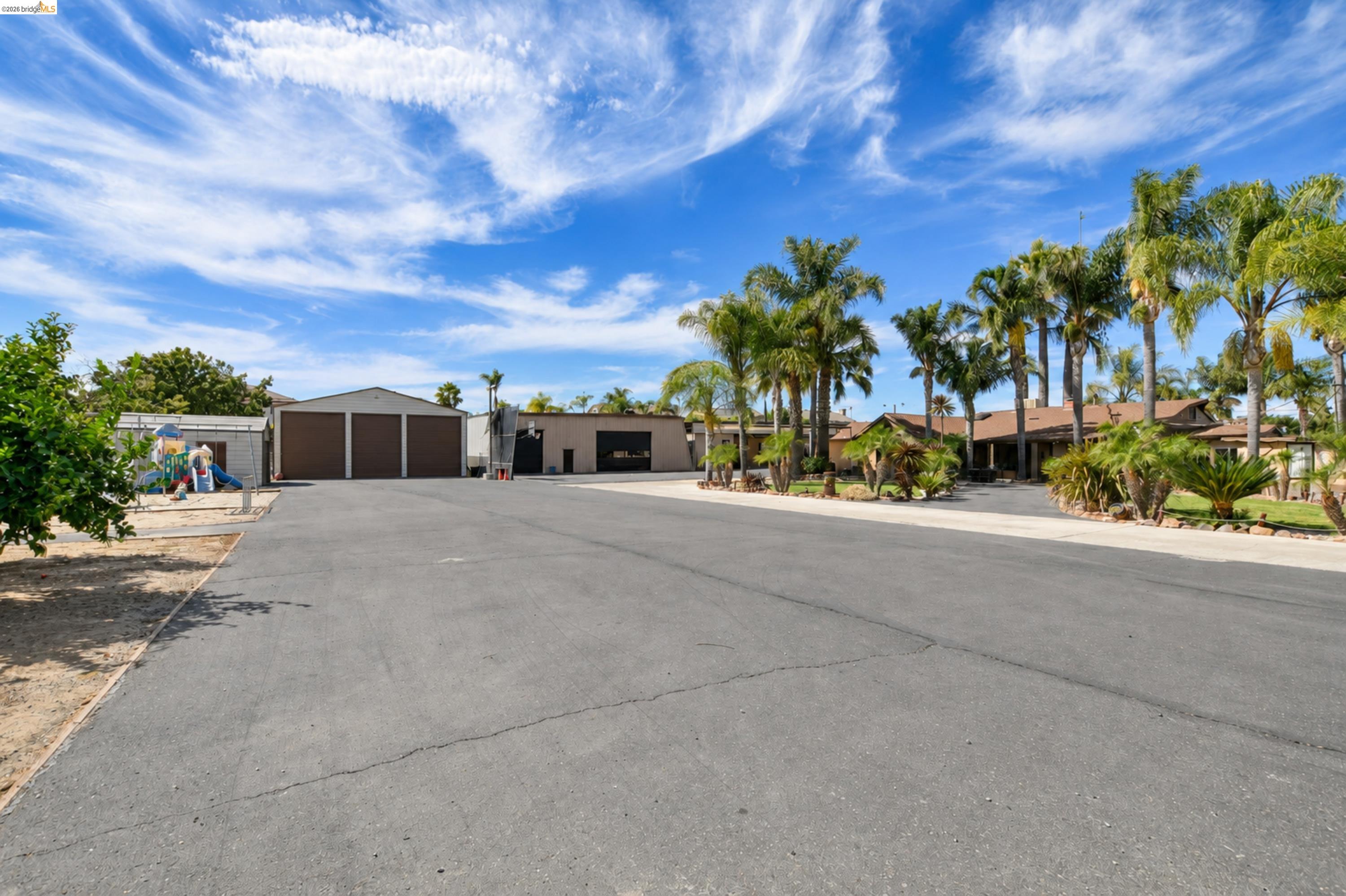 340 West Bolton Road Oakley, CA 94561 - Photo 70 of 87 Expansive paved driveway leading to multiple buildings with garage doors