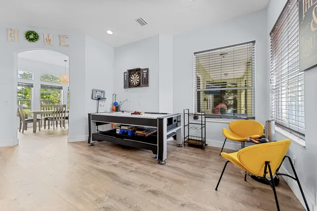a bedroom with furniture and a window
