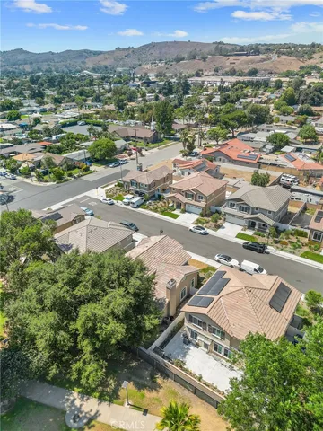 an aerial view of residential houses with outdoor space