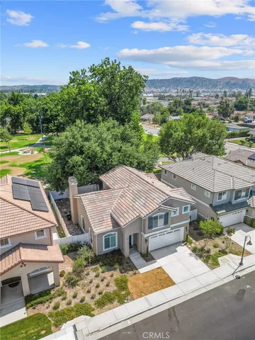 an aerial view of a house with a big yard