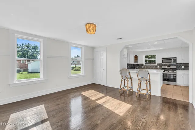 a view of a kitchen and dining room