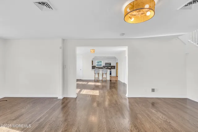 a view of a livingroom with wooden floor
